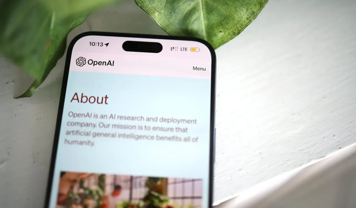 mobile phone with open ai logo on the screen